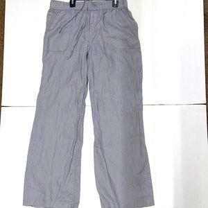 Gray linen pants with front and back pockets.